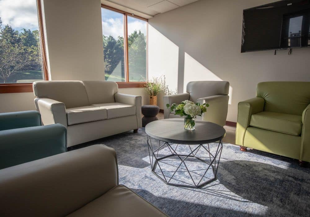 Comfortable lounge with sofas and large windows