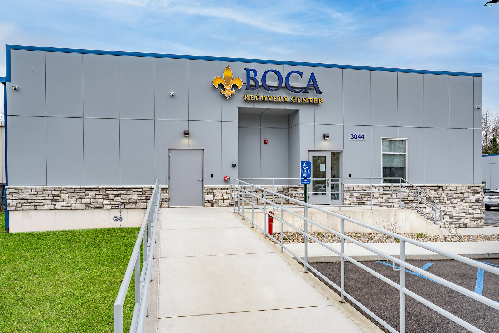 Facility entrance with ramp and BOCA Recovery Center sign