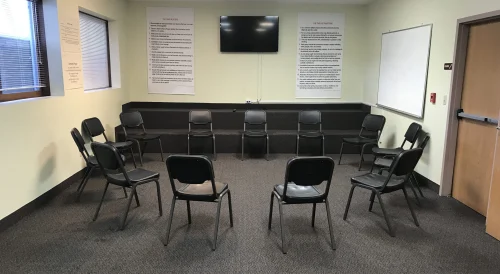 Group therapy room with chairs arranged in a circle