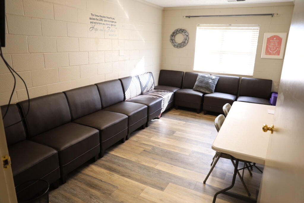Leather seating and folding table under window with natural light