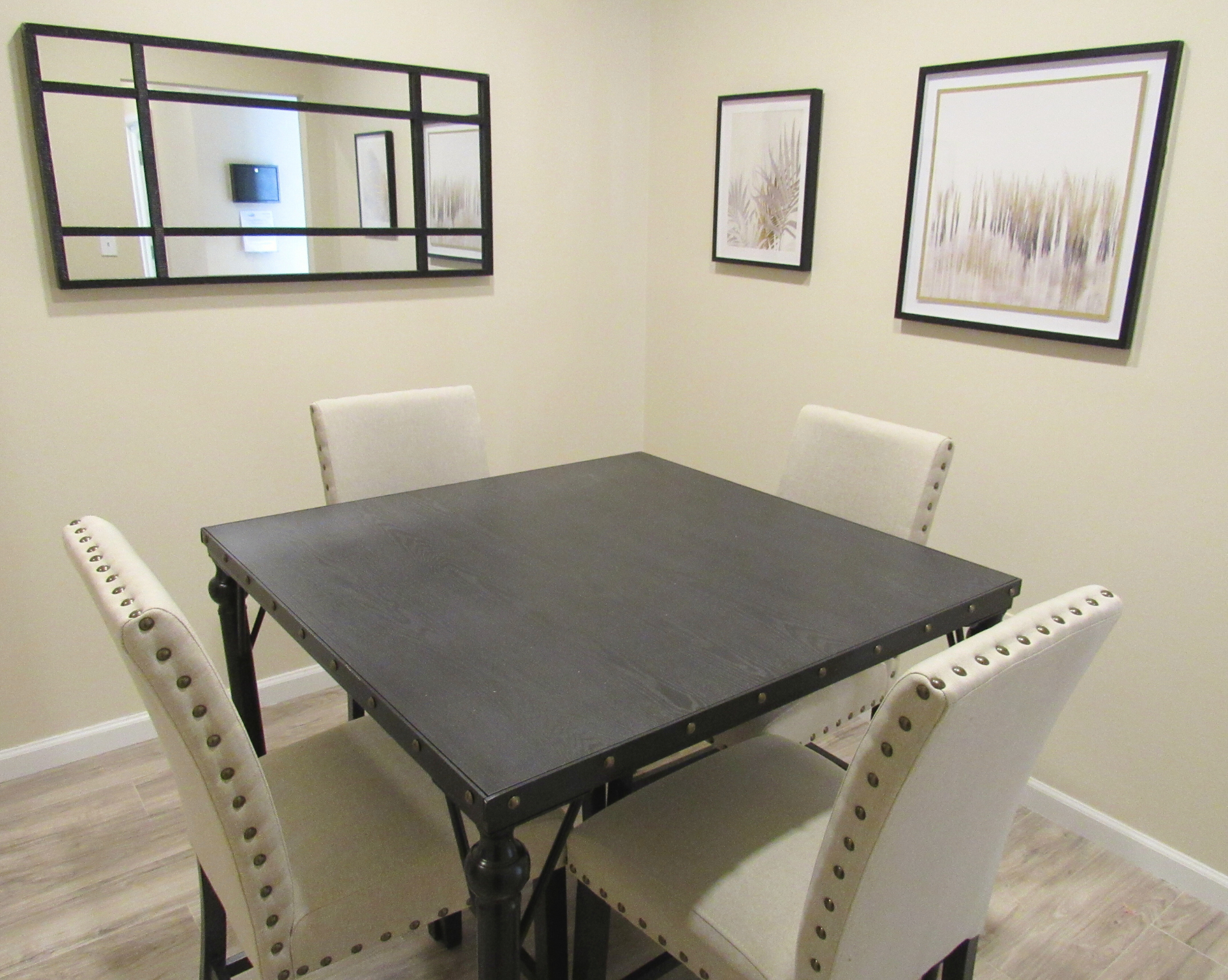 A small meeting room with a black table