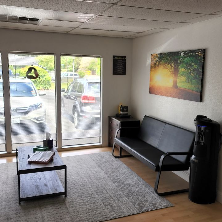 Waiting area with seating and table.