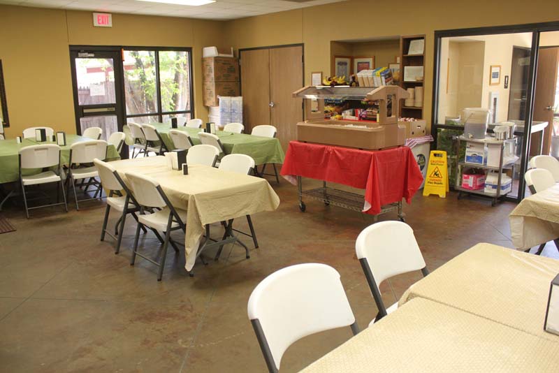 Dining hall with tables and buffet setup