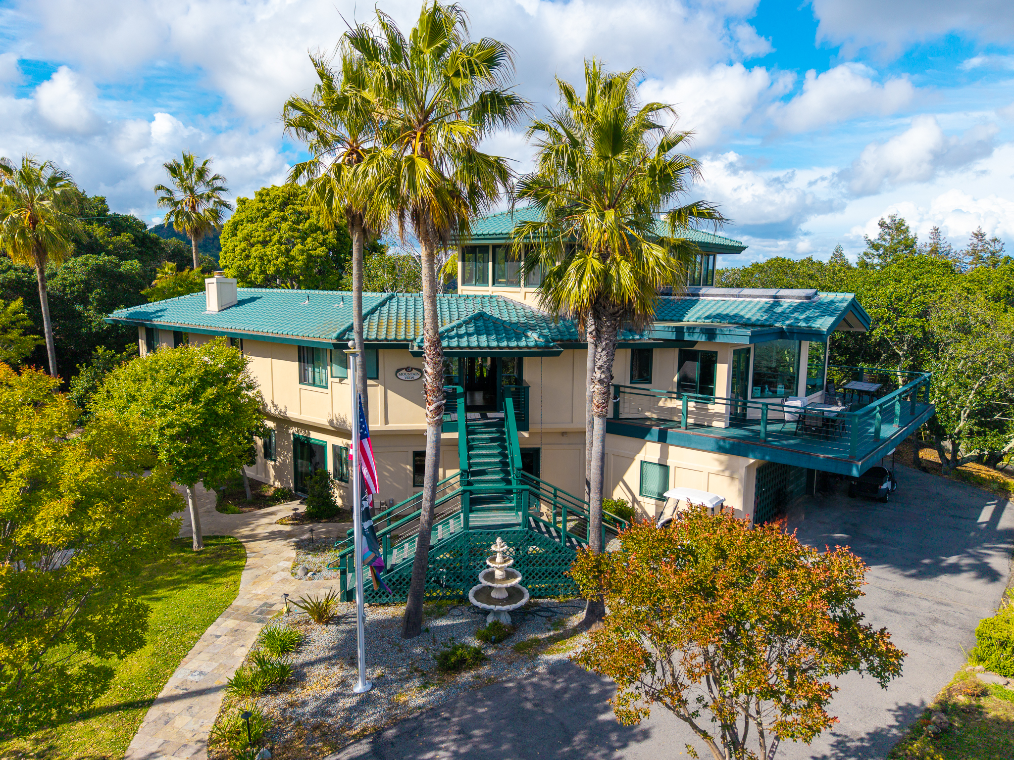 Exterior of treatment center surrounded by palm trees