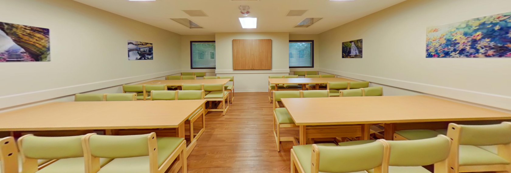 Activity room with tables and cushioned seating