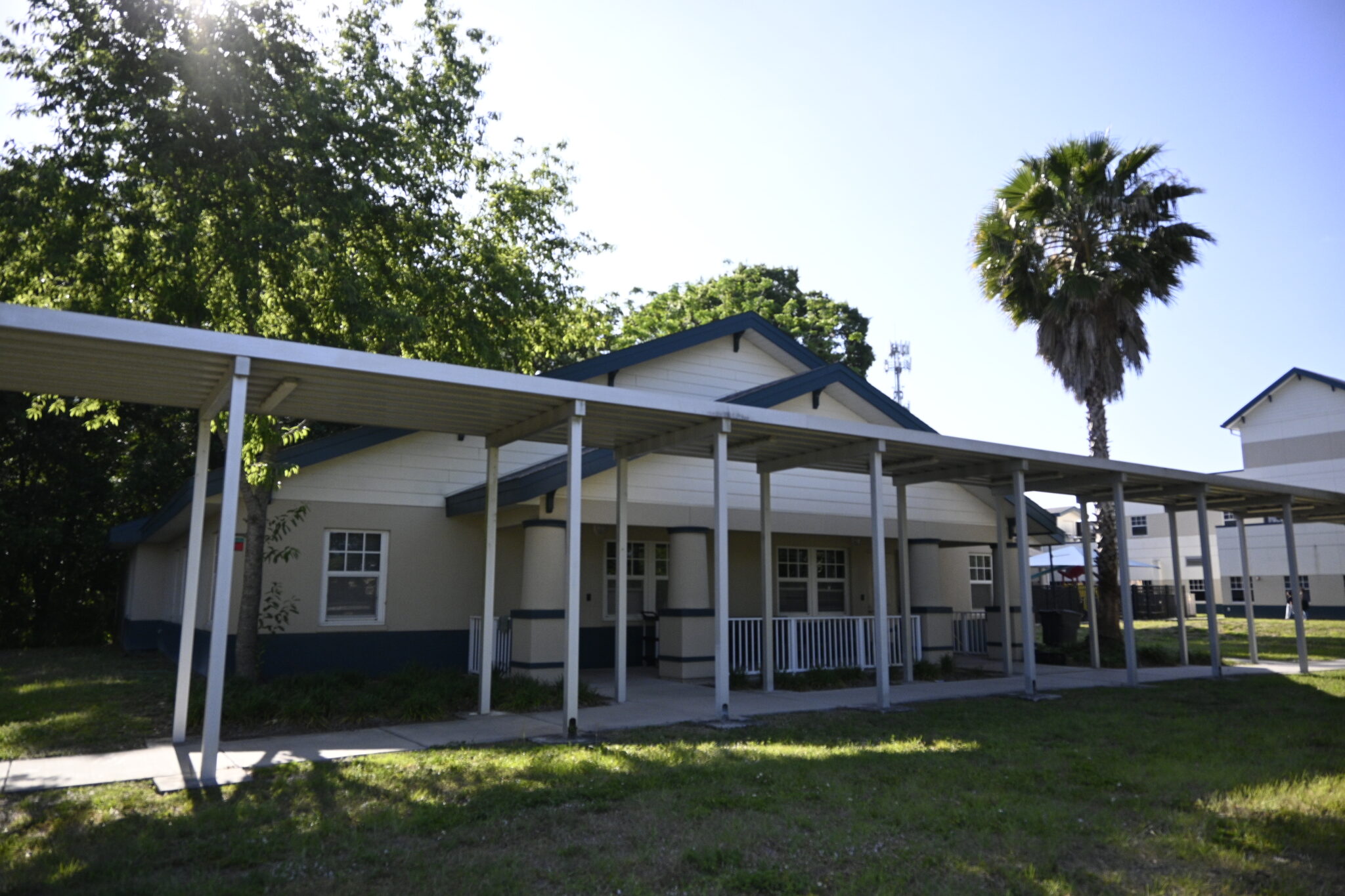 Pavilion walkway leading to a residential building entrance