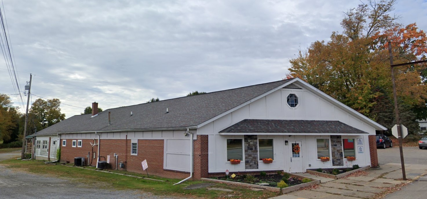 Front view of rehab facility: brick exterior, pitched roof