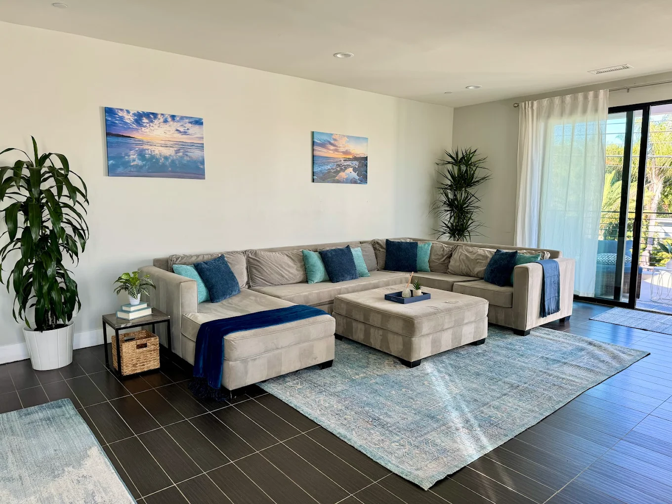 Large living room with sectional sofa and bright decor