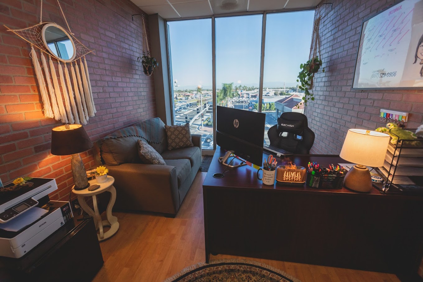 Therapy room with  sofa and desk.