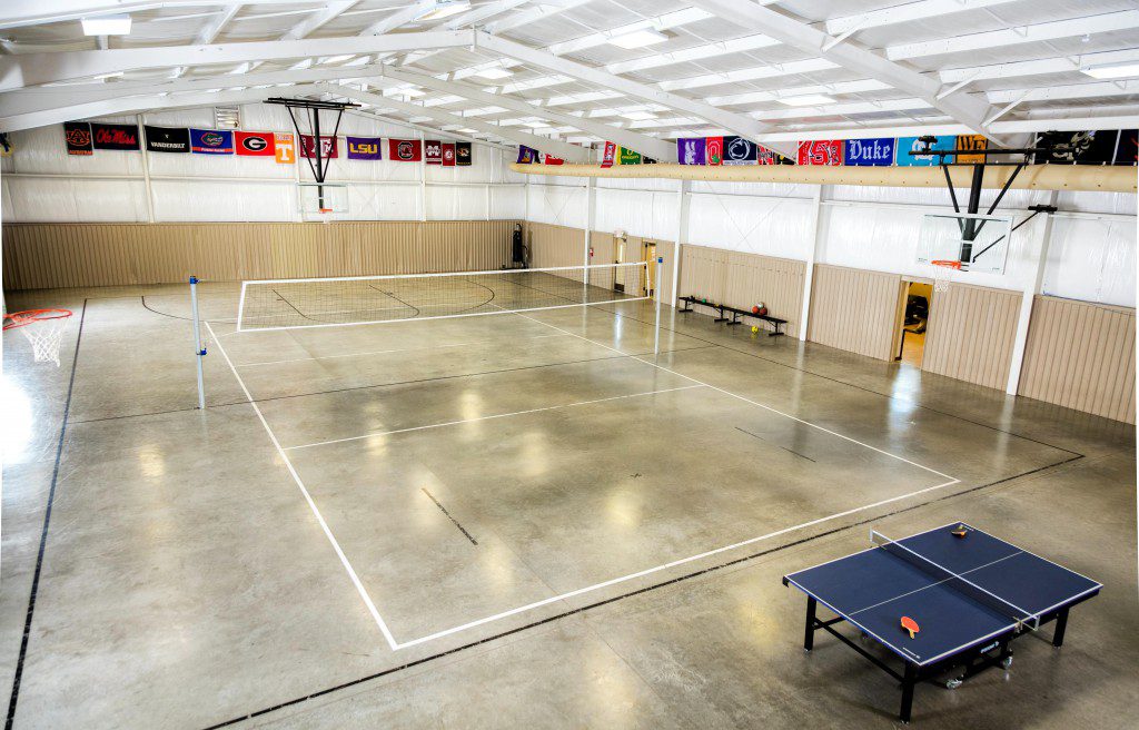 Indoor recreation court with volleyball and table tennis
