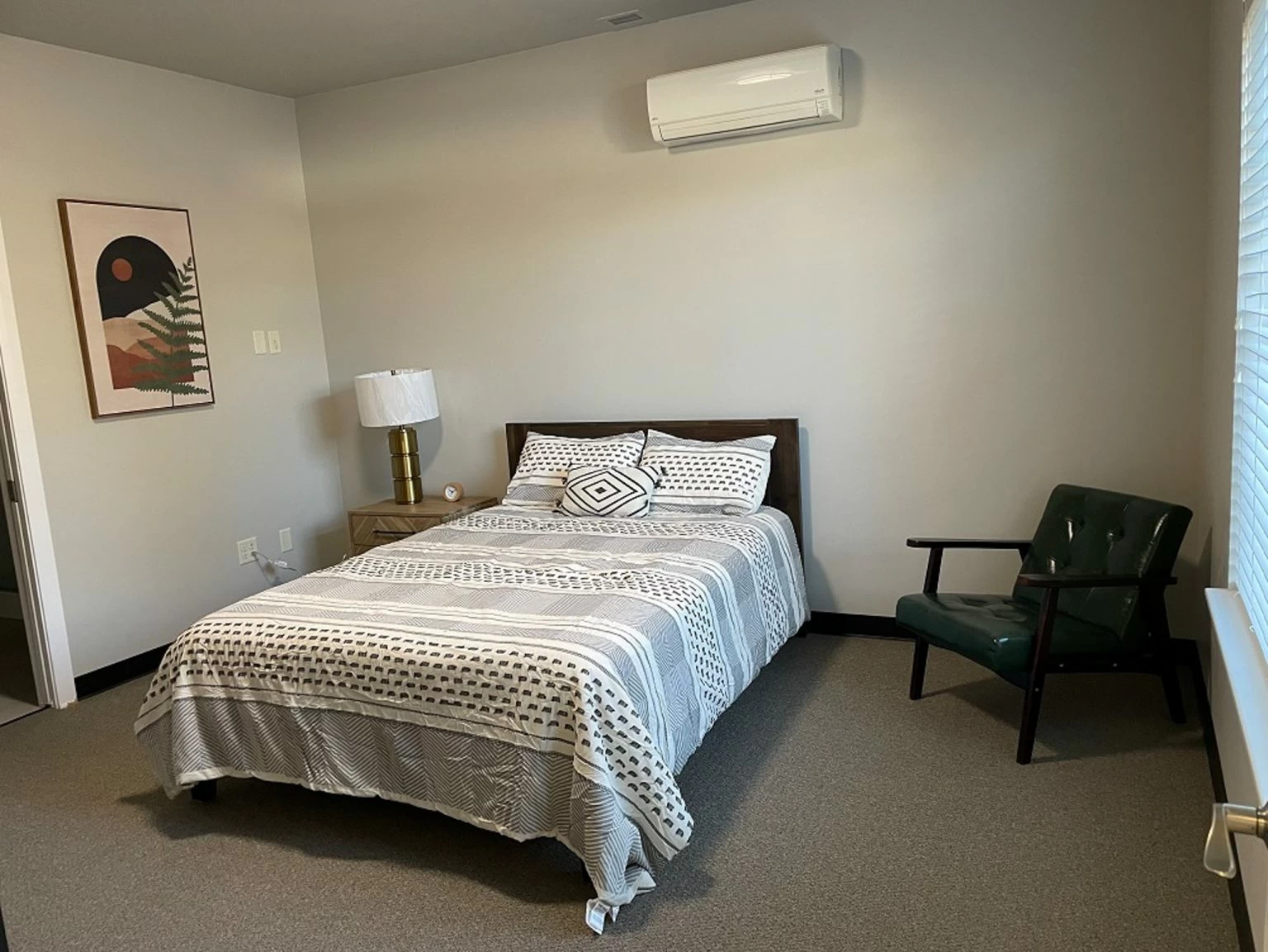 Private bedroom with queen bed and seating area