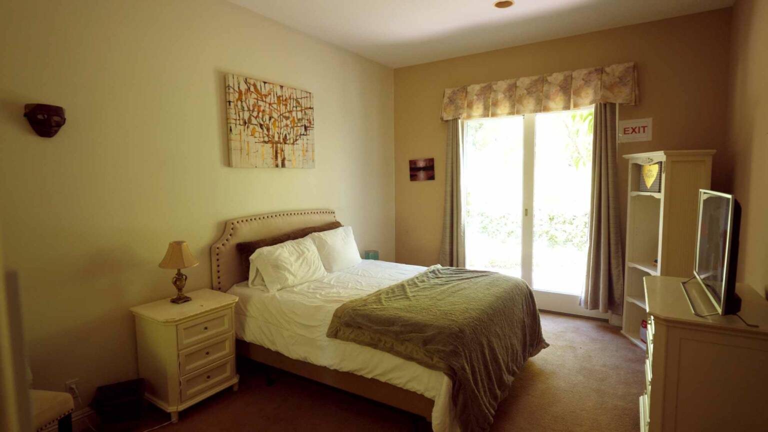 Private bedroom with queen bed and natural light