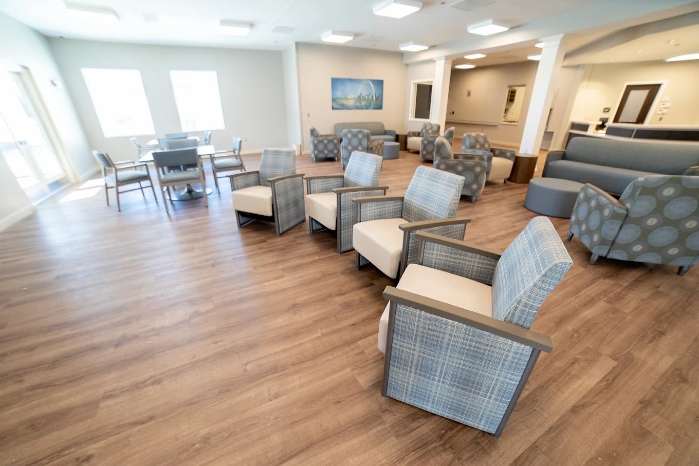 Bright common lounge with comfortable chairs and tables
