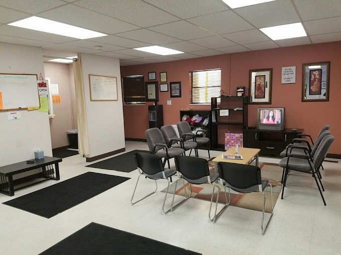 Waiting area with seating and a TV.