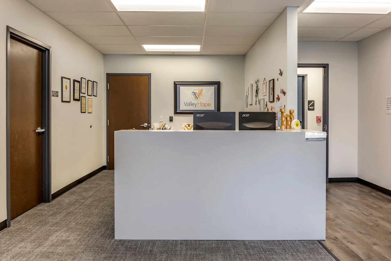 Reception desk with computers in clean office lobby