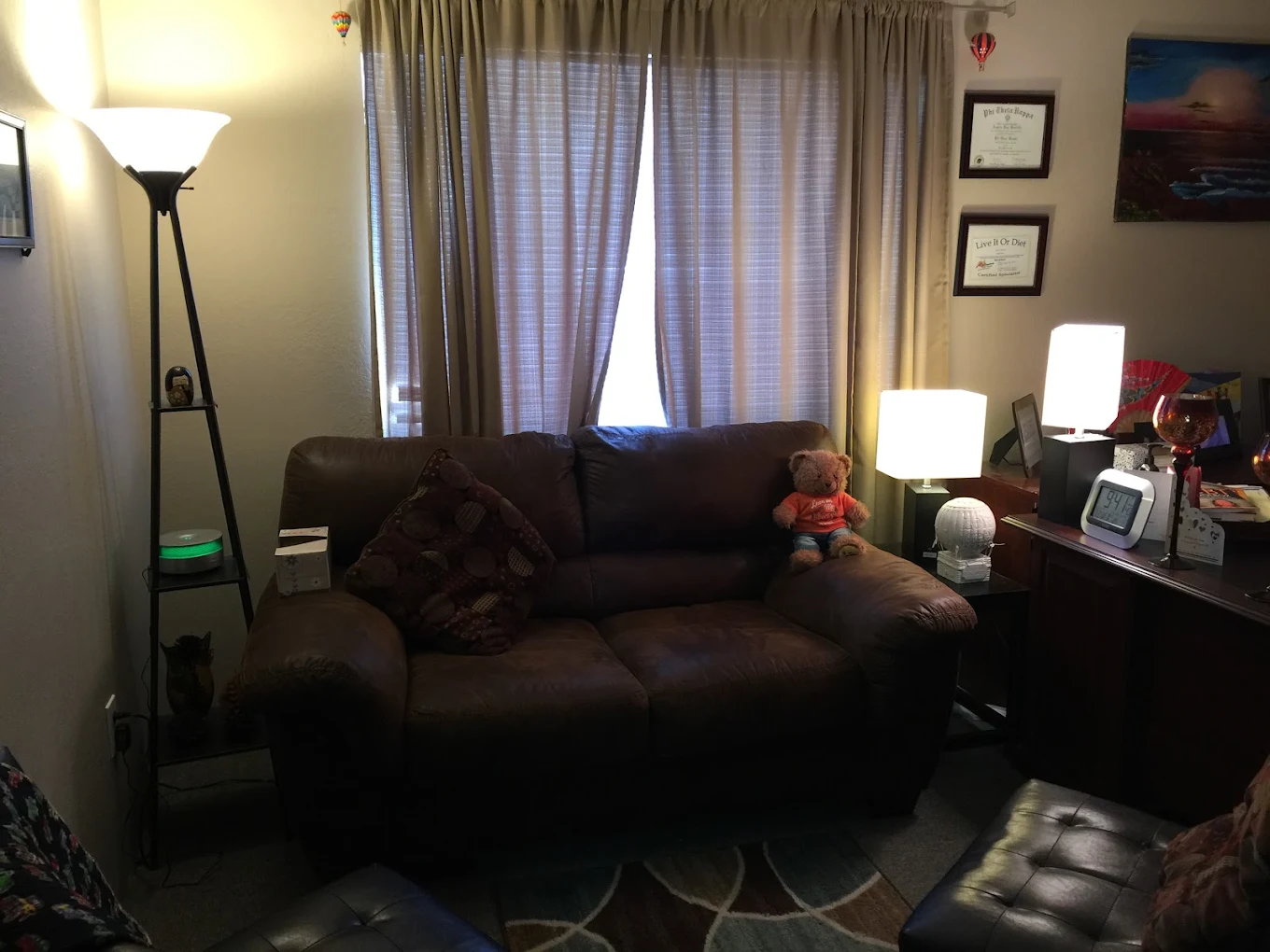 Private counseling office with couch and teddy bear