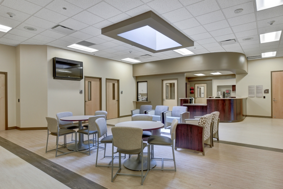 Rehab center seating and reception with round dining tables