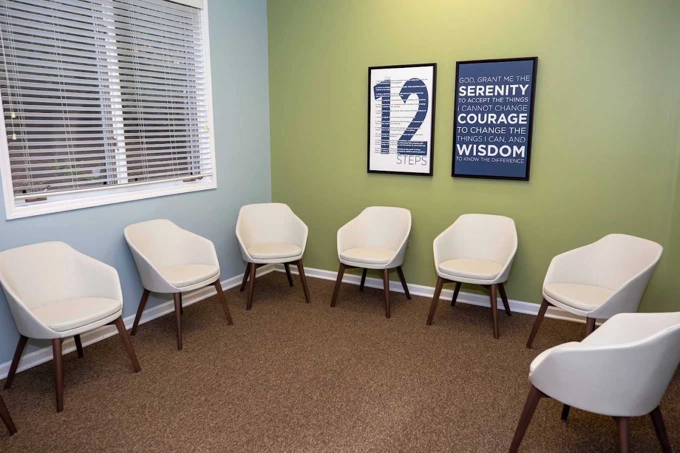 Group room with chairs arranged in a circle by the windows