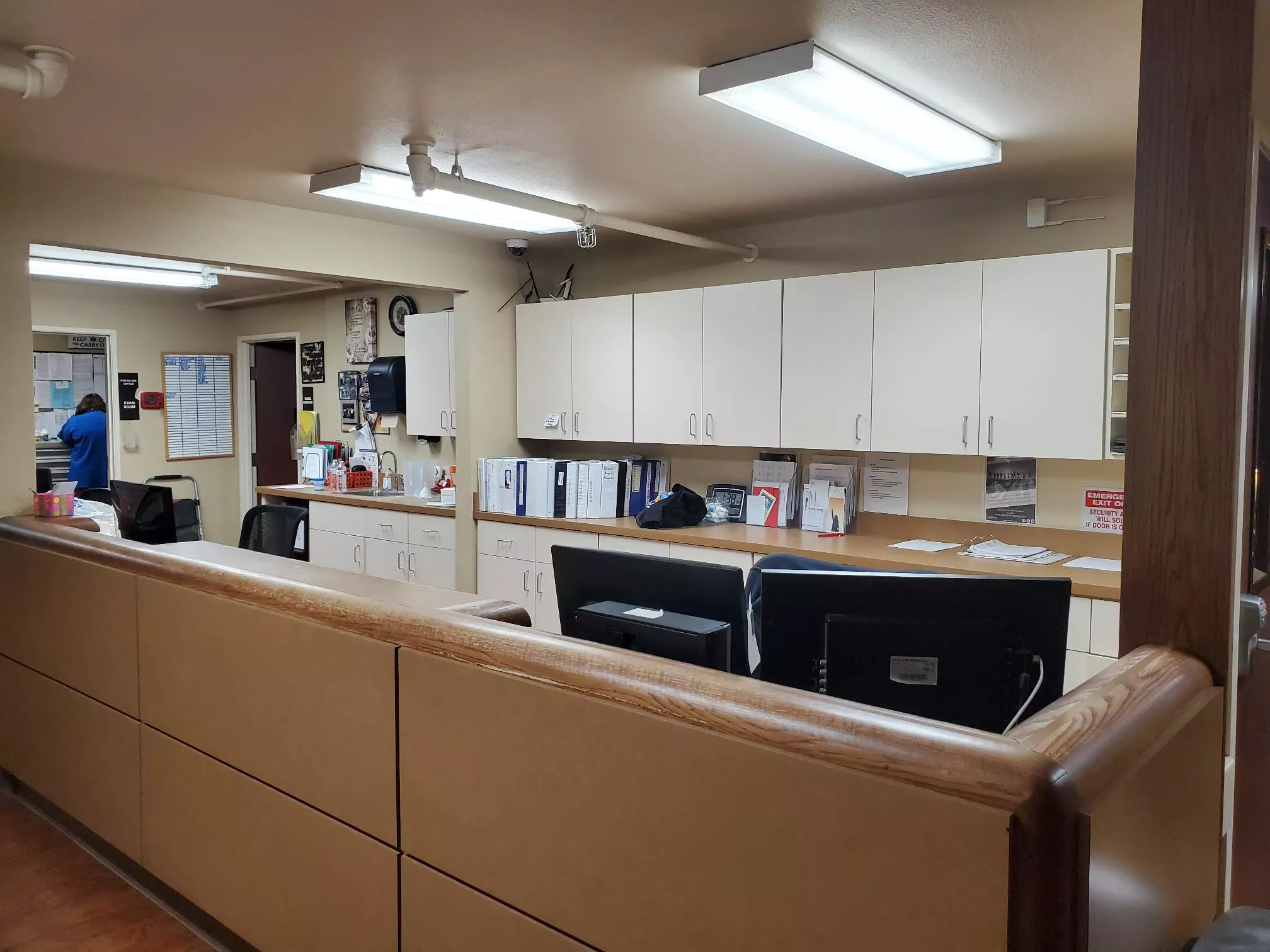Nurse station with counters, storage cabinets, and work area