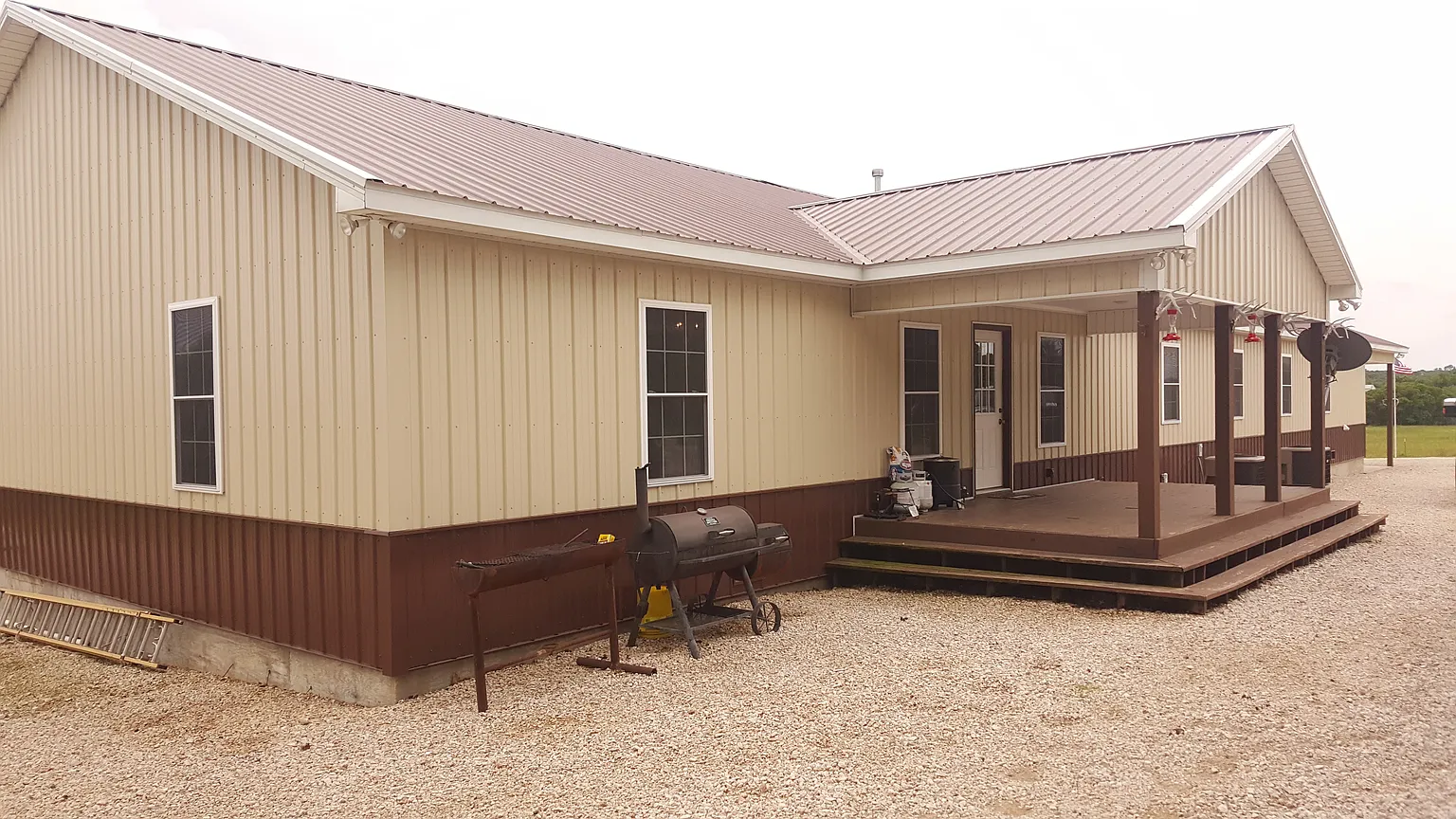 Front of Kisa Life Recovery Sedan, with a well-maintained exterior and a welcoming porch area.