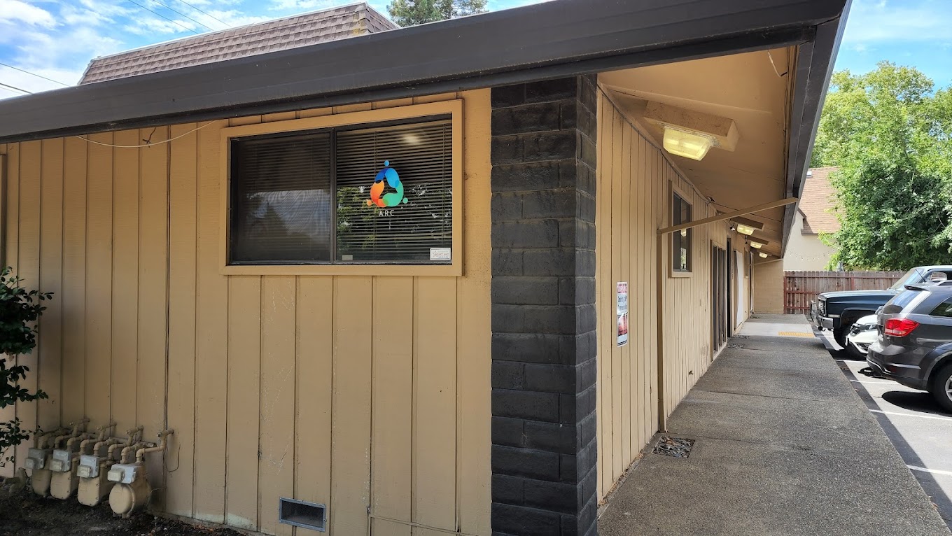 Building exterior with accessible parking and and entrance.