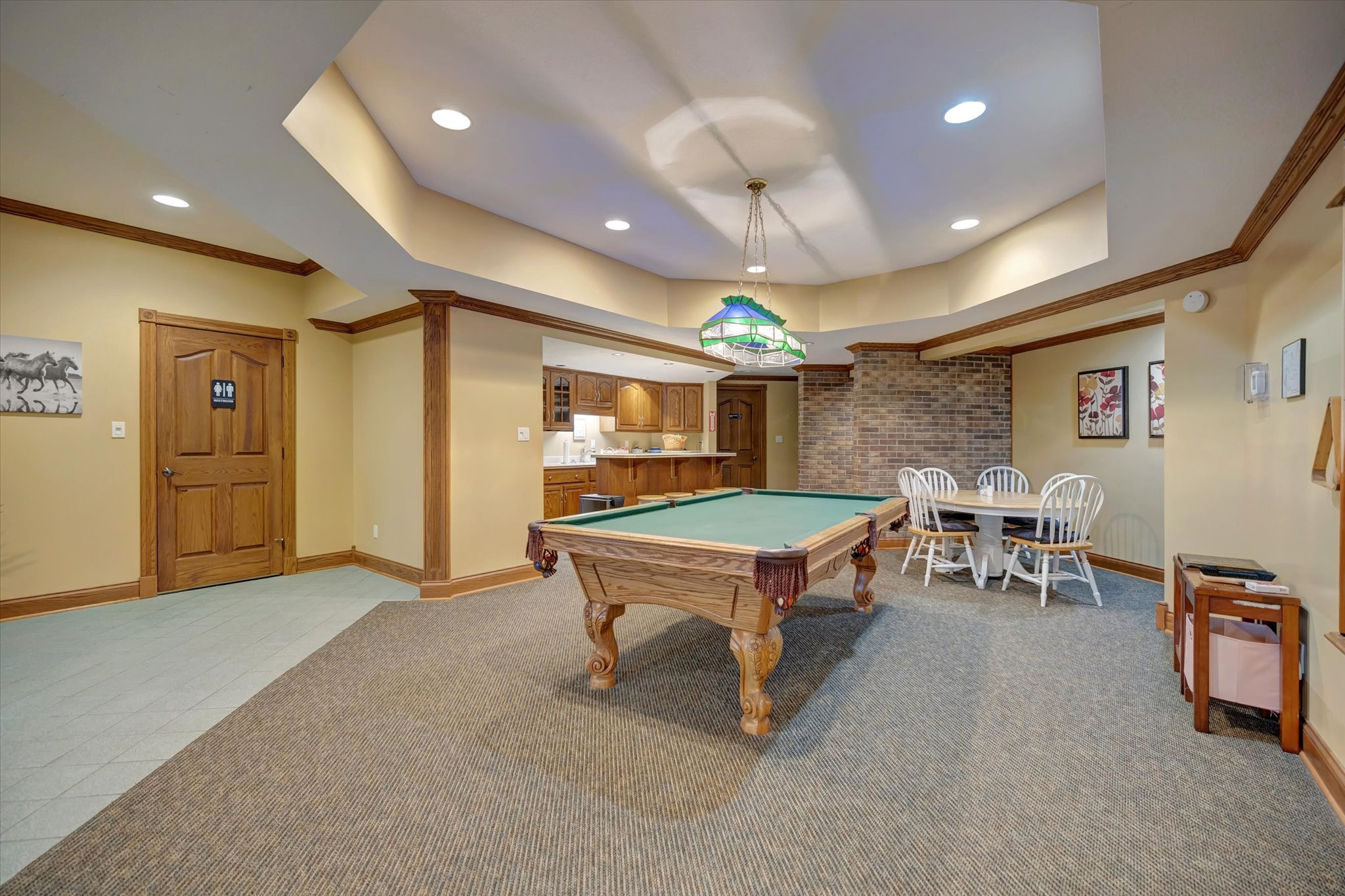 Billiard room with pool table and seating area