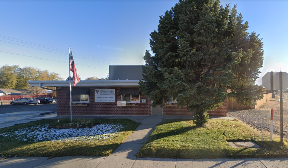 Front entrance of brick Center of Hope building with flag