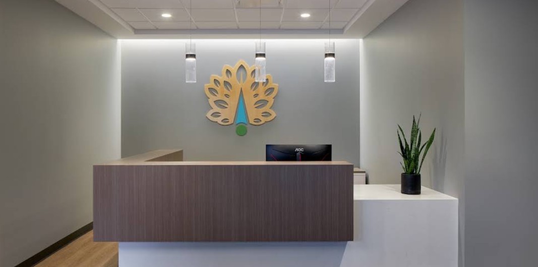 Reception desk with modern finishes and Northpoint Recovery logo