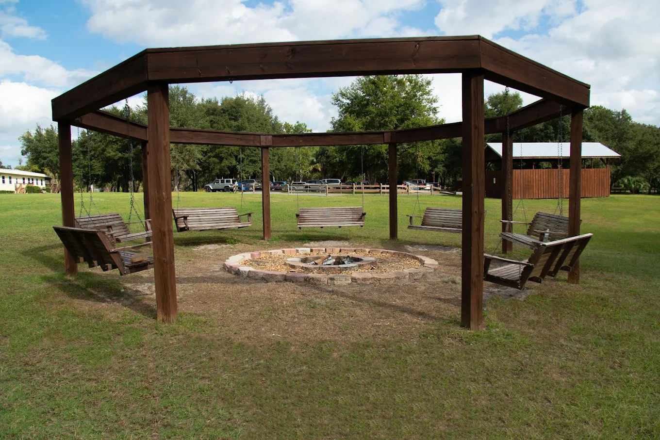 Swing seating surrounding an outdoor fire pit