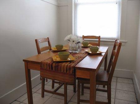Simple dining area with table set for four