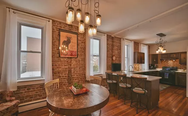 Rustic kitchen with island and round table