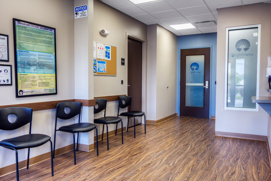 BrightView Ashtabula lobby with patient seating, informational displays, wood-look flooring, and interior service window
