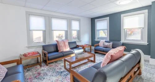 Cozy lounge with sofas and pink pillows