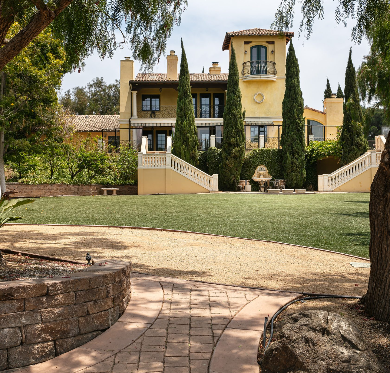 Mediterranean-style rehab center with lawns and garden stairs