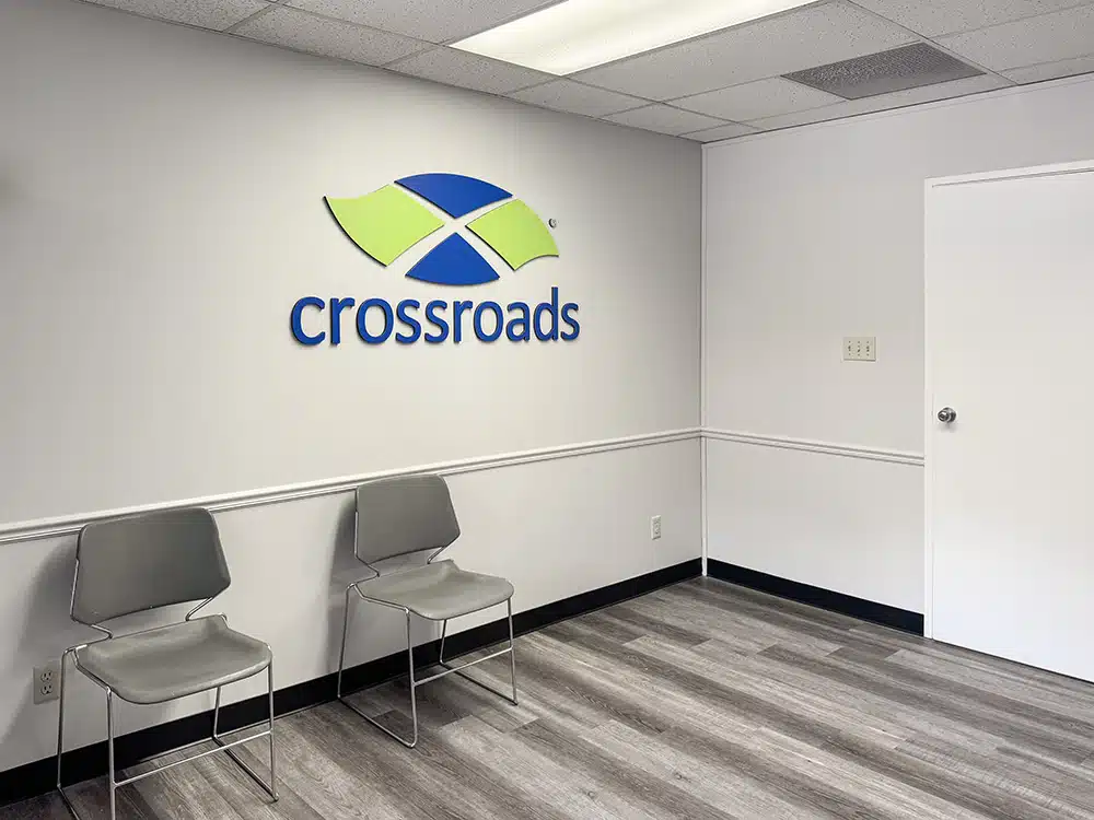 Waiting area with chairs and Crossroads logo wall