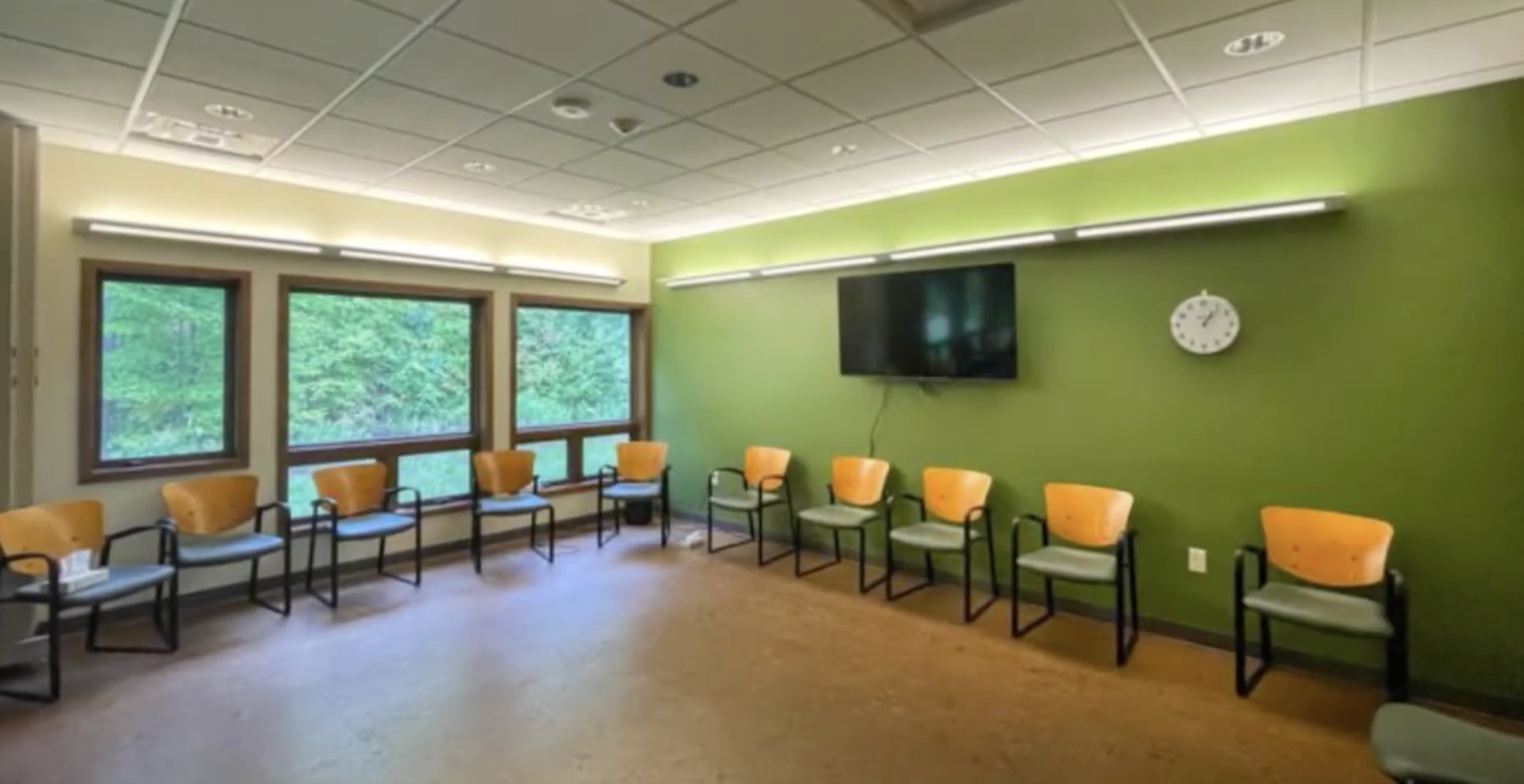 Bright group room with chairs arranged around the walls