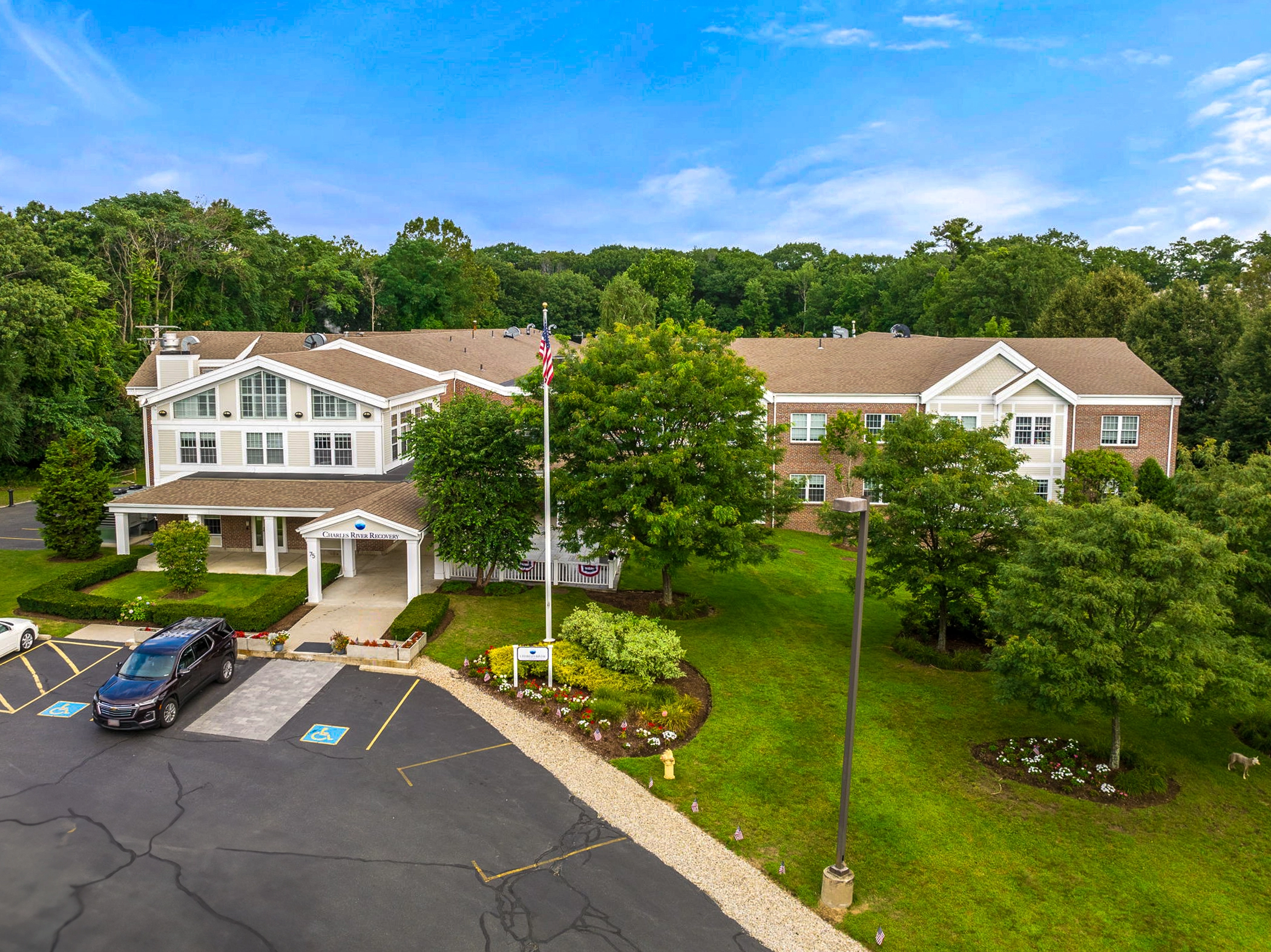 Facility building with entrance and parking.