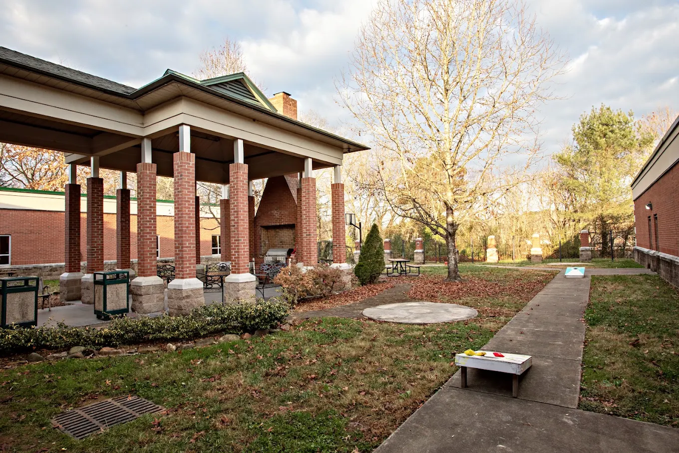 Landscaped grounds with covered patio and walking path