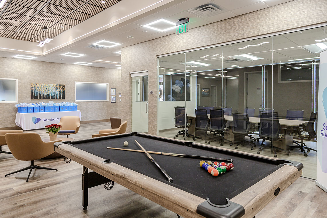 Recreation area with pool table and lounge seating