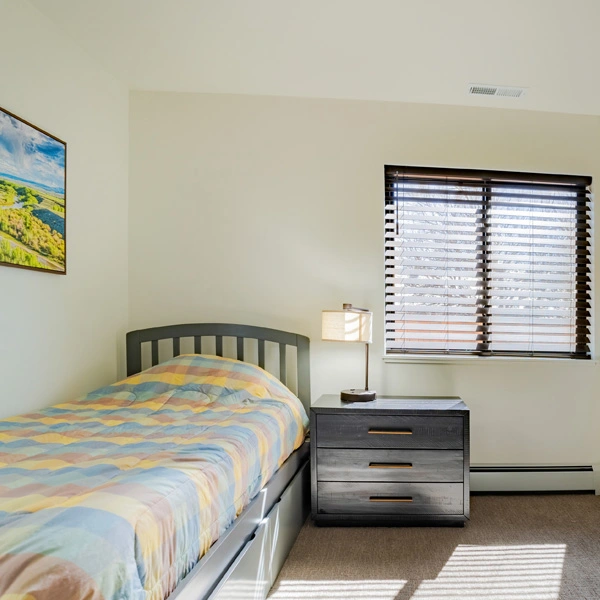 Private bedroom with single bed and natural light