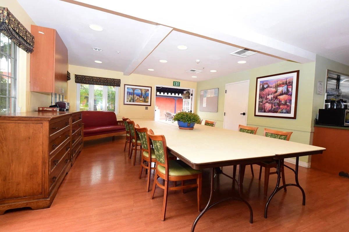 Dining room with long table and natural light
