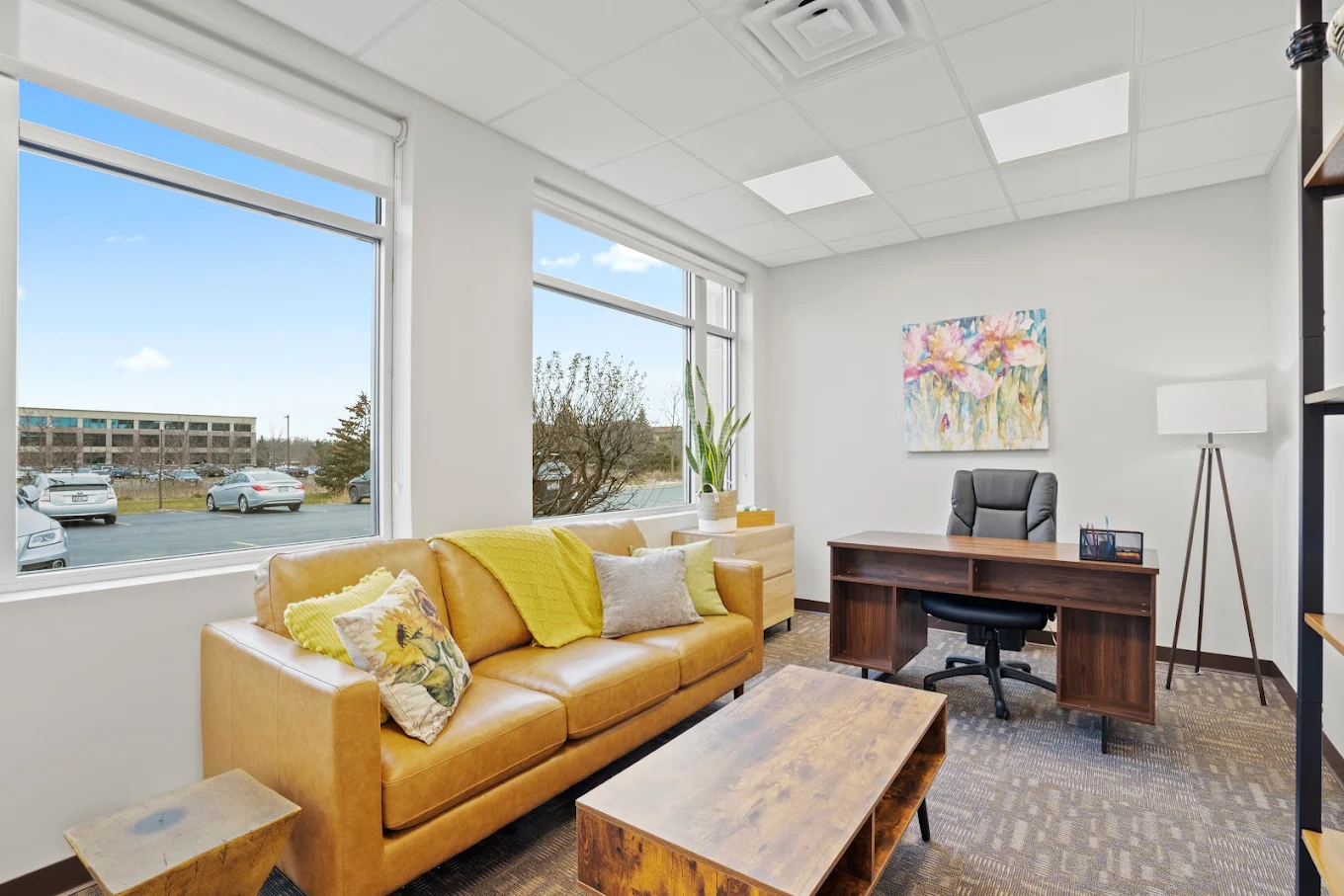 Bright counseling office with sofa and desk