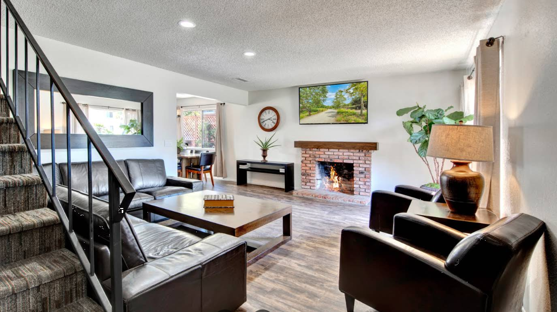 Living room with leather seating and fireplace
