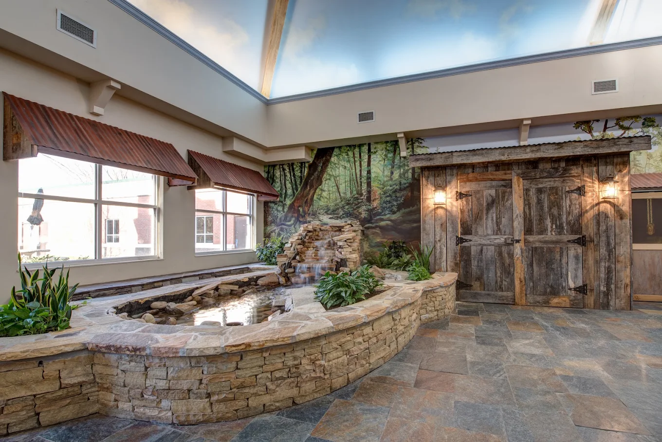 Outdoor courtyard with stone patio and covered seating