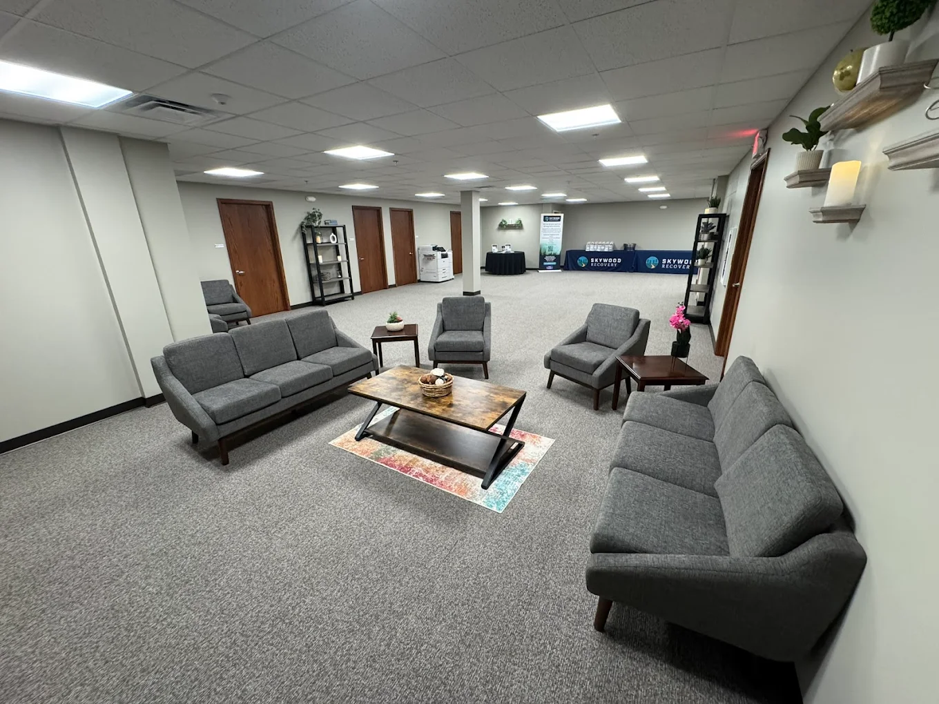 Comfortable client waiting lounge with sofas and seating