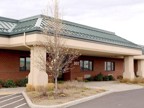facility main building with brick wall