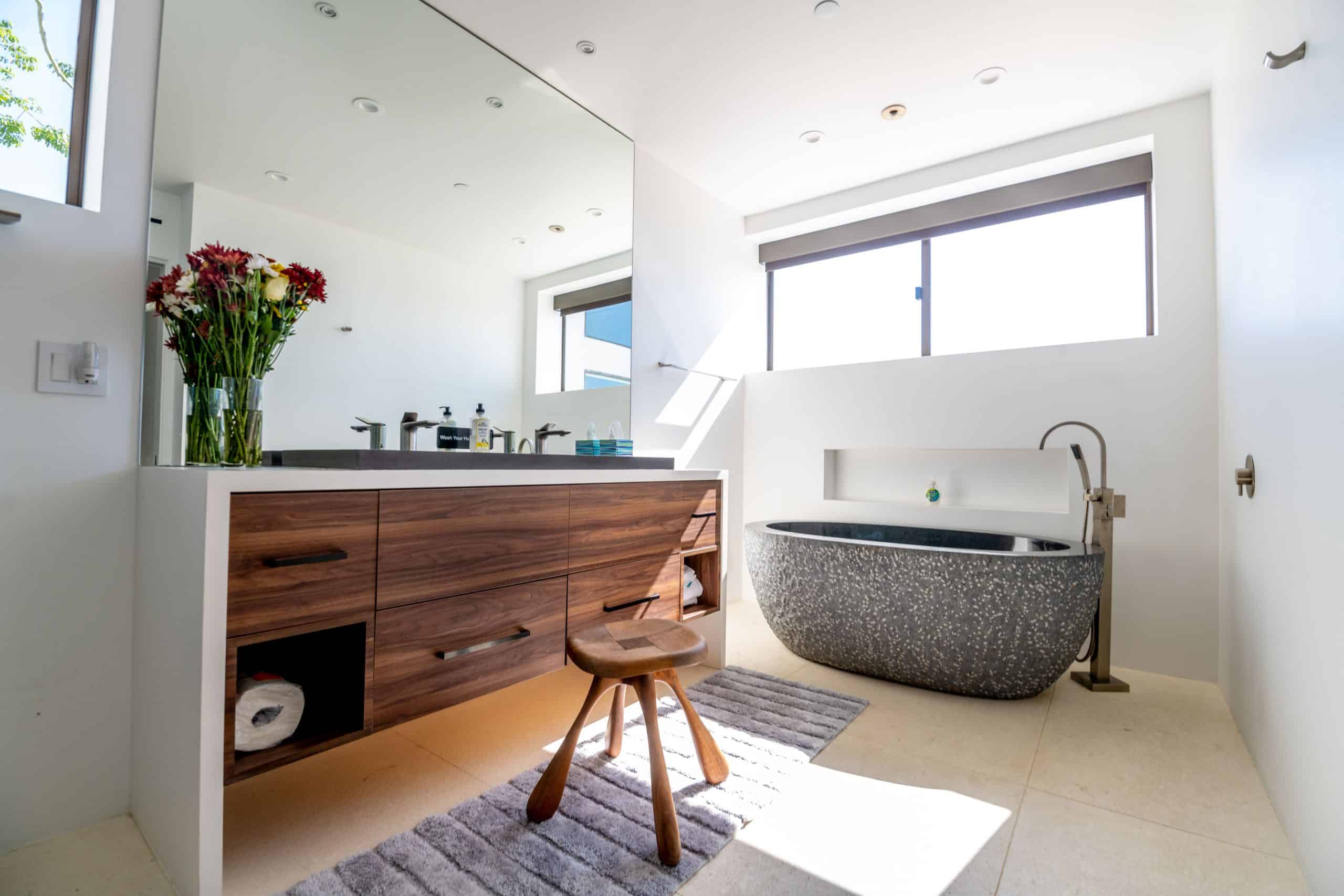 Private bathroom with soaking tub and modern vanity