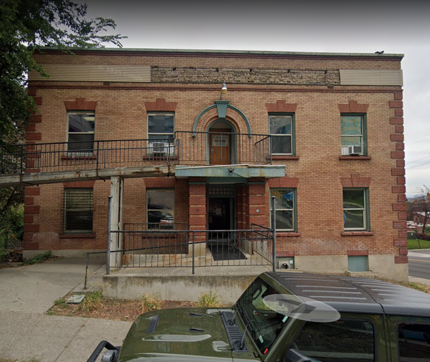 Two-story brick rehab facility with side ramp and entryway