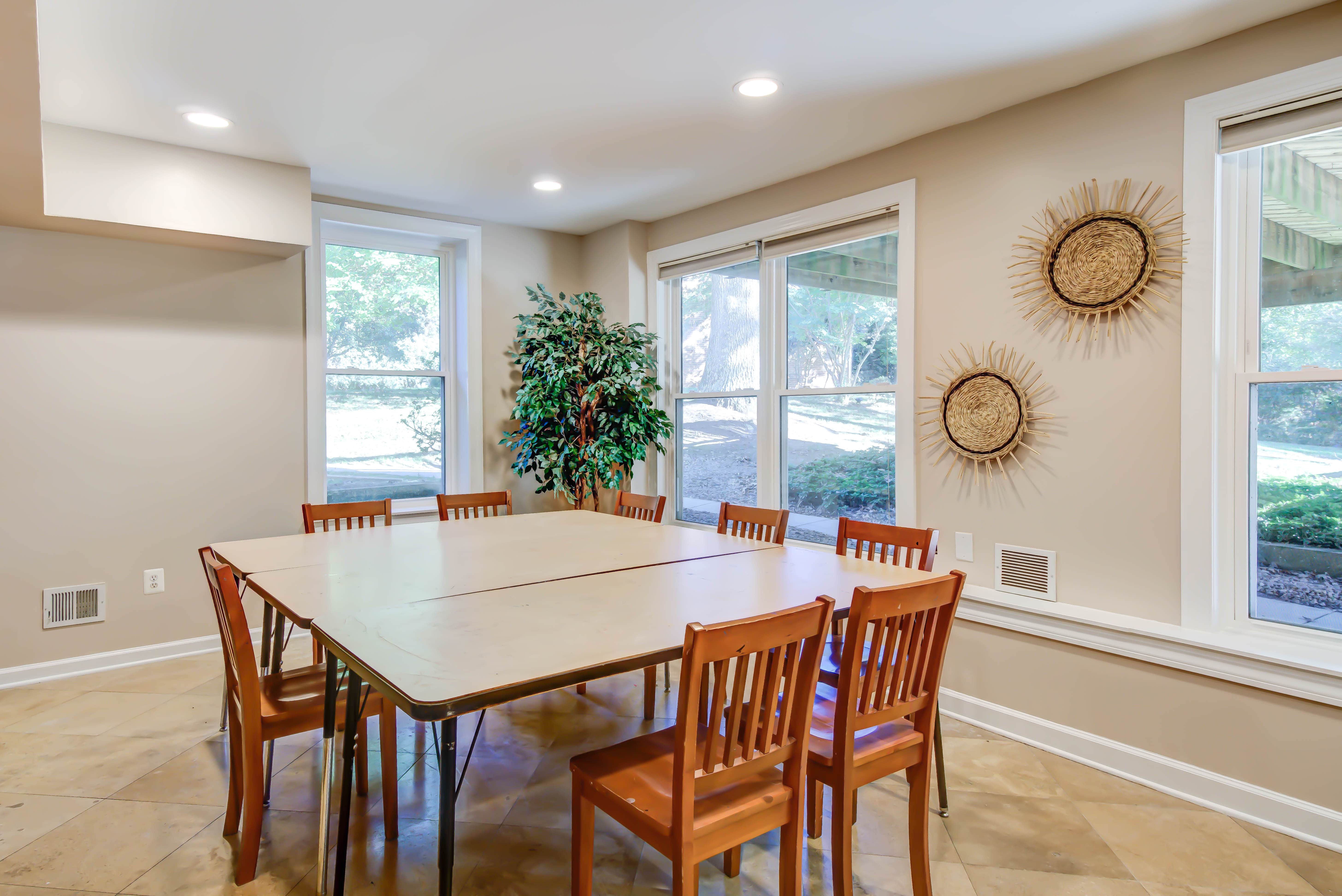 Group meeting space with folding tables and wooden chairs