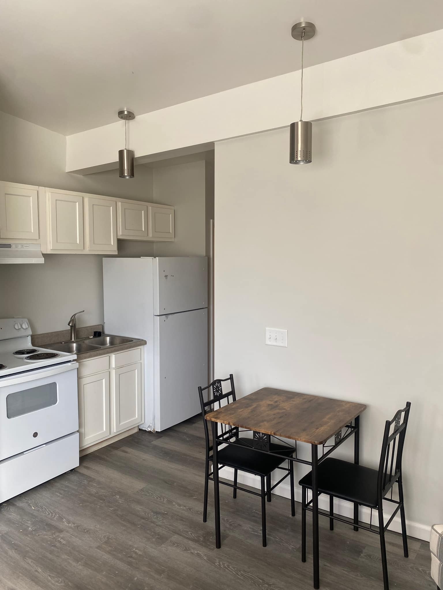 Dining table beside sofa and armchair
